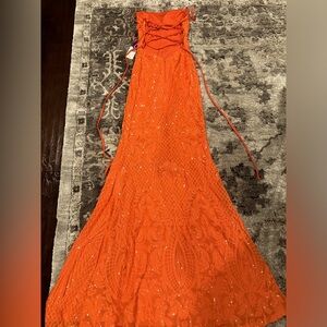 Size small orange prom dress. New never worn. tag still on.